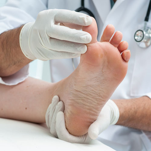 Doctor examining patient's feet